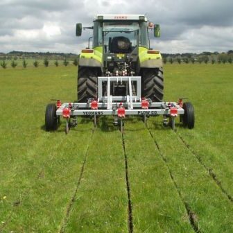 Yeomans plow working fitted fixed shanks and crumble roller also tickle pot seeders, coulters on john deere tractor