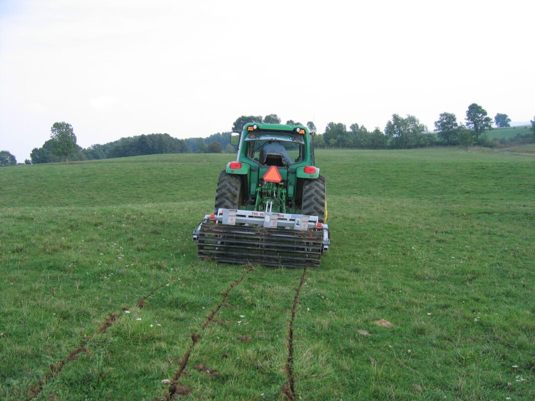 Yeomans plow working fitted fixed shanks and crumble roller also tickle pot seeders, coulters on john deere tractor