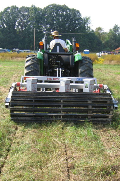 Yeomans keyline plow fitted with tickle pot feeders and crumble roller - on a john deere tractor - subsoil regeneration
