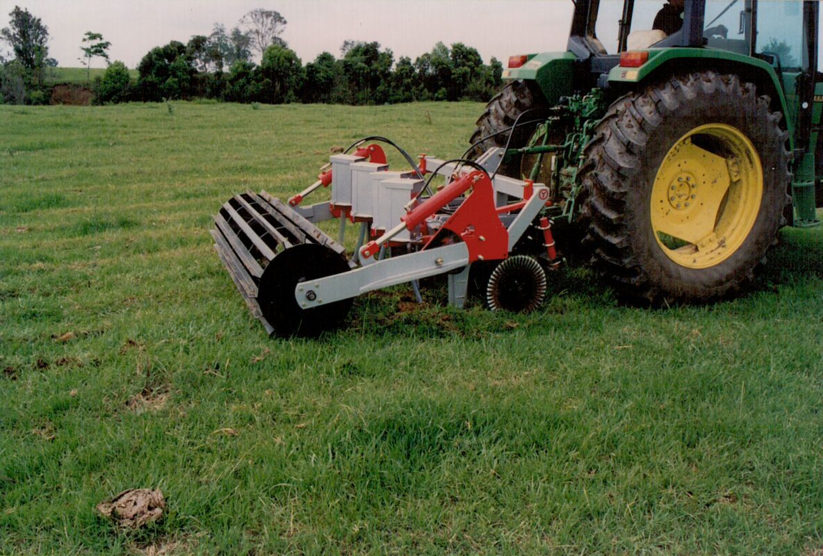 Yeomans plow working fitted fixed shanks and crumble roller also tickle pot seeders, coulters on john deere tractor