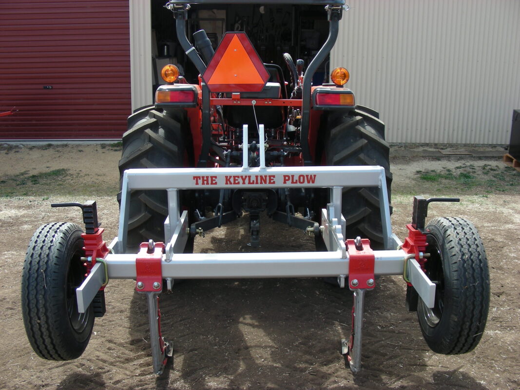 Yeomans plow on kubota tractor fitted with ripple bar height wheels and 2 shanks