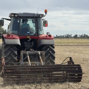 Yeomans old plow fitted with hydraulic crumble roller - red case tractor