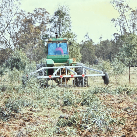 Image (18 Yeomans plow on a green tractor with Obstructions trees and roots