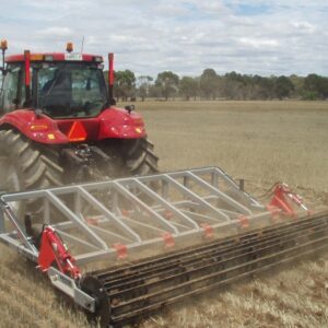 Yeomans l65 fitted with fixed 26 inch shanks and hydraulic crumble roller - working in compacted pasture