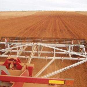 Yeomans Plow with fixed shanks and hydraulic depth control and crumble roller